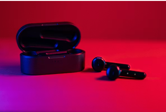White wireless earbuds in charging case