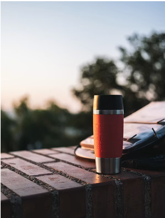 Stainless travel mug on a desk